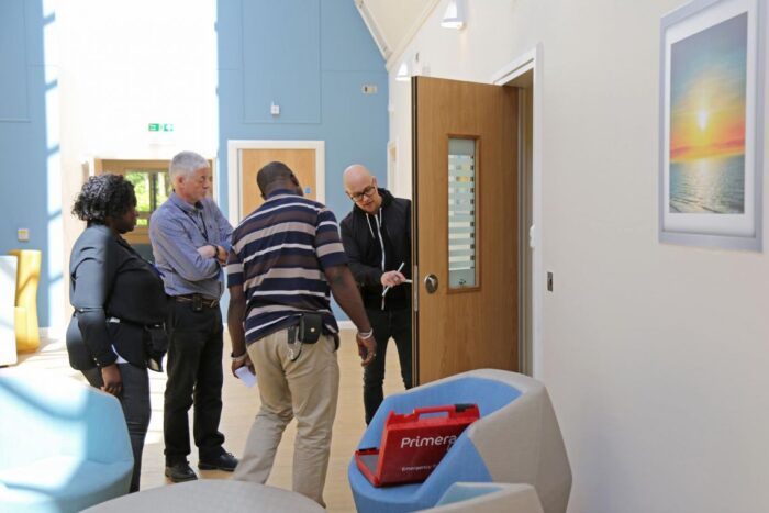 Anti barricade door opening into the corridor